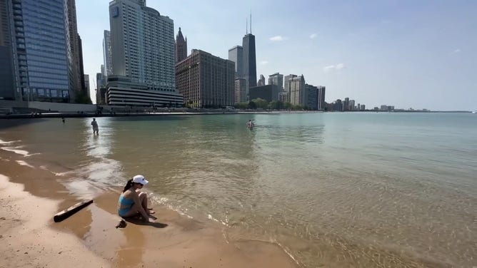This image shows a person cooling off in Lake Michigan in Chicago.