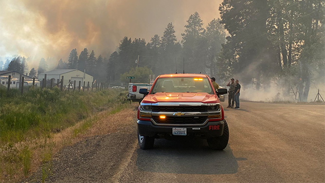 This image shared by the Kittitas County Sheriff's Office in Washington shows fire crews and smoke filling the air due to the Red Bridge Fire on June 9, 2025.