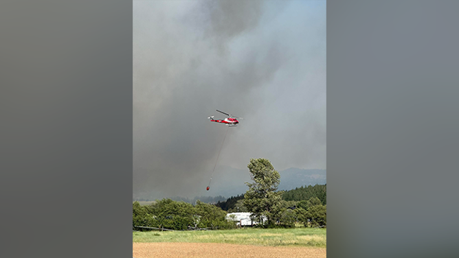 This image shared by the Kittitas County Sheriff's Office in Washington shows a helicopter responding to the Red Bridge Fire on June 9, 2025.