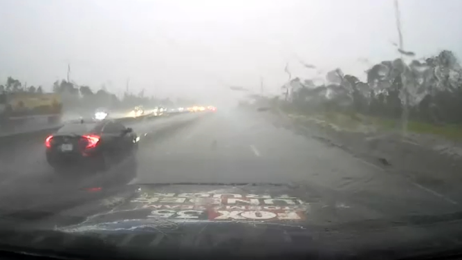 FOX35 Orlando Thundertruck drives through heavy rain.