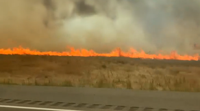 Watch: Couple veers off Idaho interstate as flames from wildfire blow across roadway