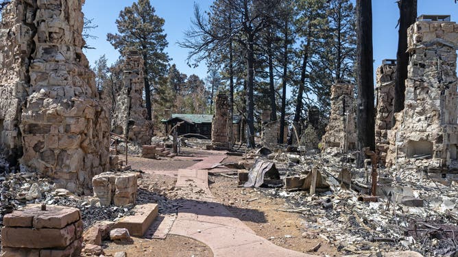 Stone chimneys remaining from Grand Canyon Lodge deluxe cabins that burned when the Dragon Bravo Fire passed through this location on July 12-13, 2025.
