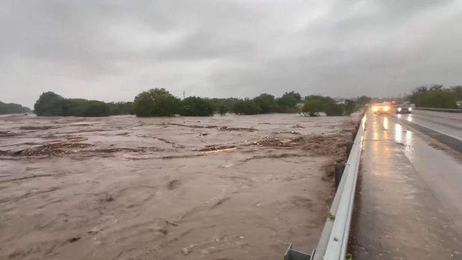 The Guadalupe River crashes against the Center Point bridge.