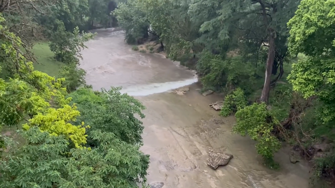 The floodwaters begin to fill the Guadalupe River banks in Center Point, Texas.