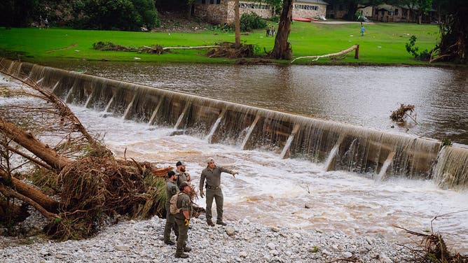 A K-9 Unit with the Texas Game Wardens conducts a search in flood damage area near Camp Mystic in Kerr County, Texas on Saturday, July 5, 2025.