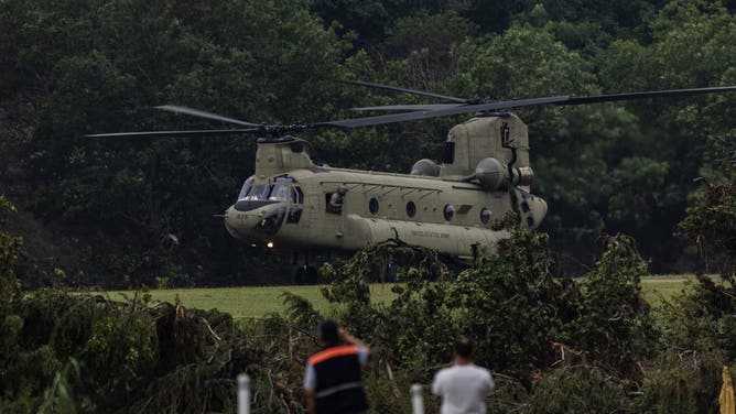 HUNT, TEXAS - JULY 6: A Chinook helicopter takes off near Camp Mystic after picking up troops that aided in search and recovery efforts on July 6, 2025 in Hunt, Texas. Heavy rainfall caused flooding along the Guadalupe River in central Texas with multiple fatalities reported. (Photo by Jim Vondruska/Getty Images)