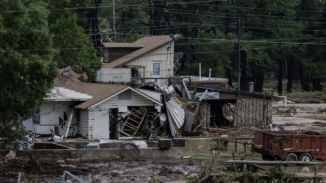 HUNT, TEXAS - JULY 6: A home covered in debris sits near the town center on July 6, 2025 in Hunt, Texas. Heavy rainfall caused flooding along the Guadalupe River in central Texas with multiple fatalities reported. (Photo by Jim Vondruska/Getty Images)