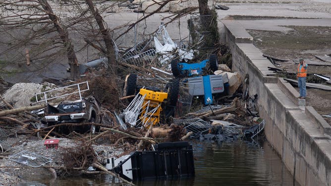 Widespread damage is visible in and around Kerrville, Texas, on July 6, 2025, following a deadly flash flood that causes the Guadalupe River to rise 26 feet in less than an hour early Friday morning. Eighty people are confirmed dead, and 40 more remain missing. Pictured: a man surveys the flood damage. (Photo by Reginald Mathalone/NurPhoto via Getty Images)