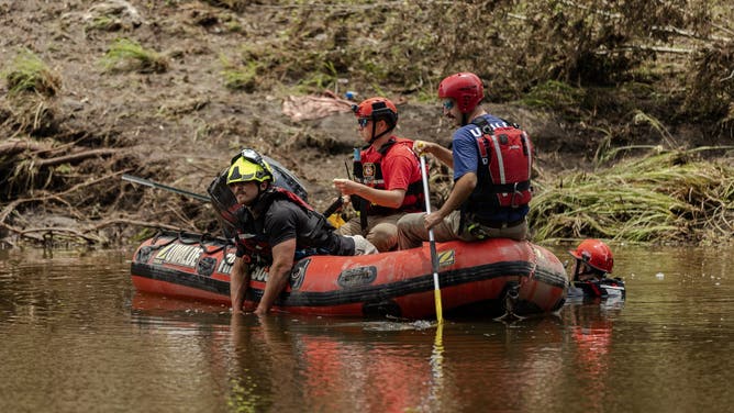 HUNT, TEXAS - JULY 7: Search and rescue workers use a sonar device while paddling down the Guadalupe River looking for survivors or the remains of victims swept up in the flash flooding on July 7, 2025 in Hunt, Texas. Heavy rainfall early Friday caused severe flash flooding along the Guadalupe River in central Texas with more than 90 fatalities reported. (Photo by Jim Vondruska/Getty Images).
