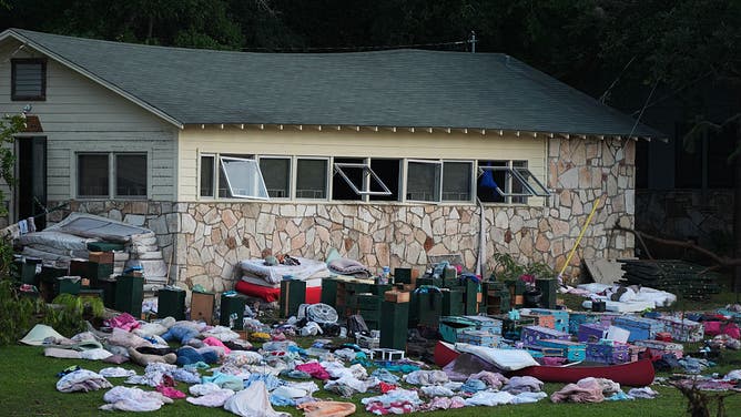Beds, furniture, and personal belongings were seen scattered outside flooded cabins at Camp Mystic on Monday, July 7, 2025, following the devastating flash floods that hit Central Texas, United States.