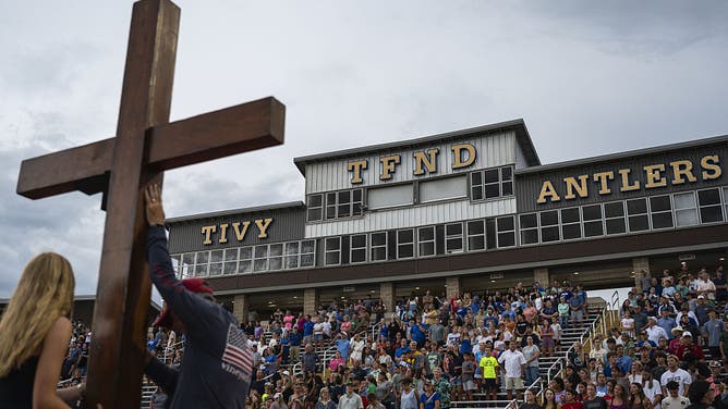 Attendees of a vigil at a high school stadium in Kerrville, Texas, US, on Wednesday, July 9, 2025.