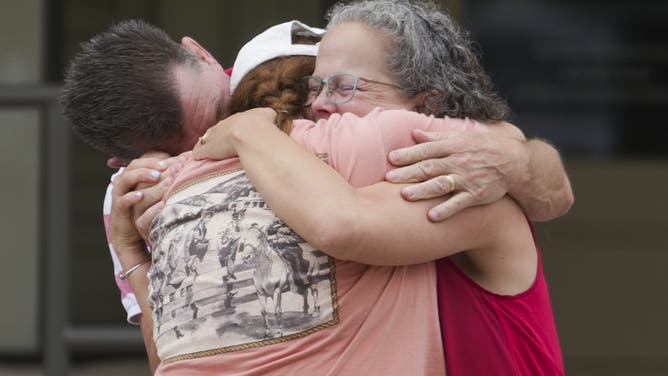 INGRAM, TEXAS JULY 5: Campers and staff from Camp Waldemar, near the North fork of the Guadalupe River, are reunited with their families after heavy rainfall in Central Texas, Saturday, July 5, 2025. (Jason Fochtman/Houston Chronicle via Getty Images)