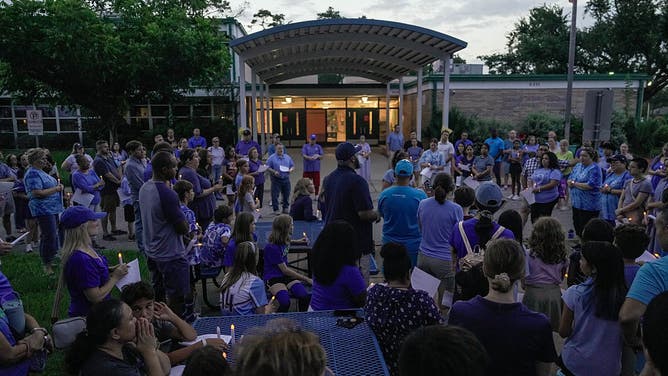 Parents, students, school faculty and community members come together at Sinclair Elementary for a vigil in honor of the missing student Greta Toranzo, who attended Camp Mystic and is among the missing after catastrophic flooding, on Saturday, July 5, 2025 in Houston.