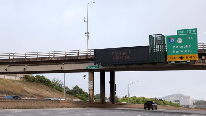HONOLULU, HAWAII - JULY 29: A freeway sign showing the 'Tsunami Warning' on the H-1 freeway on July 29, 2025 in Honolulu, Hawaii. Parts of the US west coast and Japan are being evacuated after a Tsunami warning following one of the strongest earthquakes in modern history hit Russia's eastern Kamchatka Peninsula. (Photo by Darryl Oumi/Getty Images)
