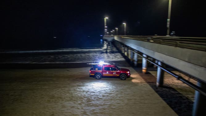 A LA County Lifeguard truck patrols Venice beach pier amid a tsunami warning in Los Angeles, California on July 30, 2025. Tsunamis hit parts of Russia's Far East and Japan on July 30 after a huge magnitude 8.8 earthquake, with warnings in place around the Pacific of waves of over three metres (10 feet) in places. (Photo by Apu GOMES / AFP) (Photo by APU GOMES/AFP via Getty Images)