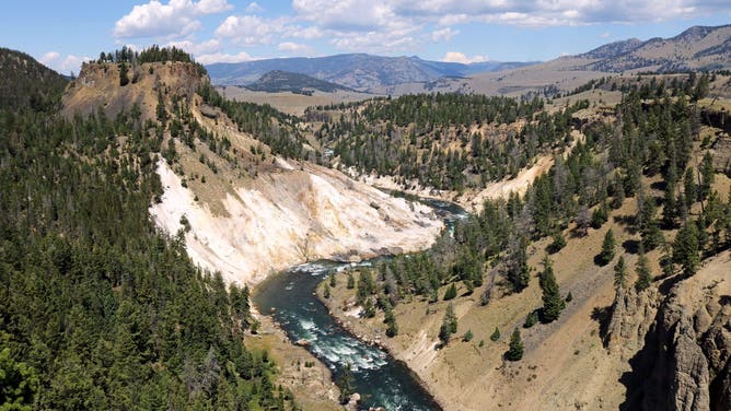 Calcite Springs along the Yellowstone River in the northern section of Yellowstone National Park Wyoming in summer, Calcite Springs is located in the northern part of Yellowstone National Park where it flows into the Yellowstone River. It is accessible on one of the main park roads.
