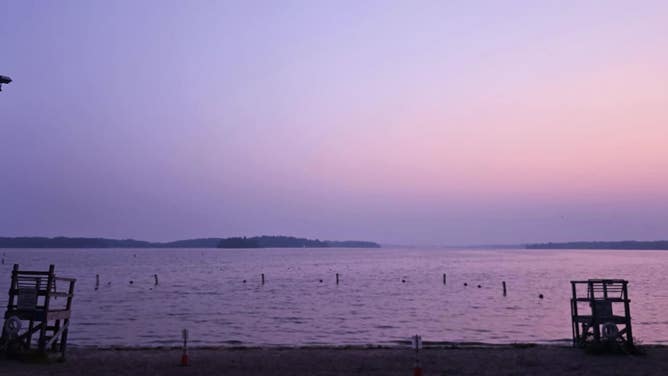 Hazy sunrise at Lake Minnetonka in Excelsior, Minnesota on July 31 as Canadian wildfire smoke creates unhealthy air quality in the upper Midwest.