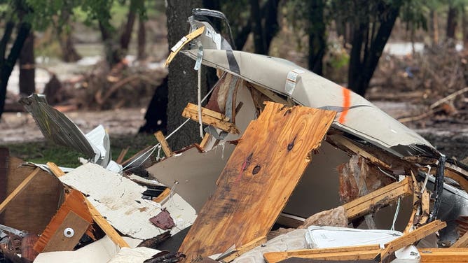 Debris from RVs and campers washed away in Kerrville, Texas during the deadly July 4, 2025 flooding.