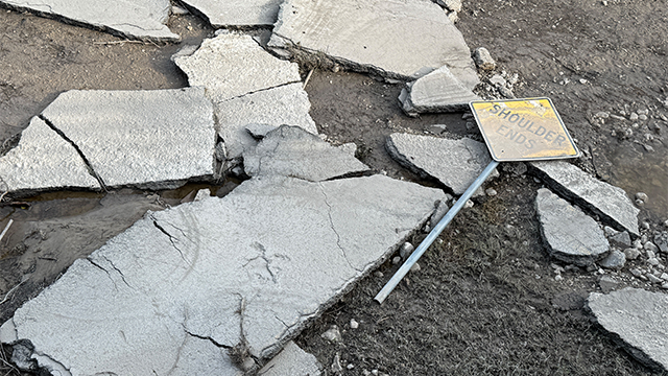 This image shows damage to a road sign after historic and deadly flooding in Texas.