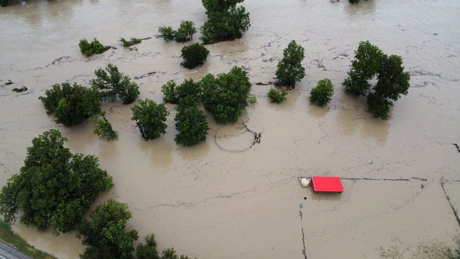 Aerial images show flooding from the Lampass River in Kempner, Texas, covering roads and flooding structures on Sunday, July 13. The river rose over 30 feet in a few hours on Sunday, reaching just below 33 feet, major flood stage.