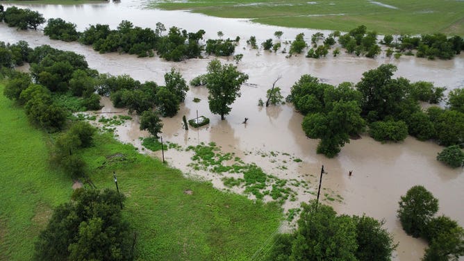 Aerial images show flooding from the Lampasas River in Kempner, Texas, covering roads and flooding structures on Sunday, July 13. The river rose over 30 feet in a few hours on Sunday, reaching just below 33 feet, major flood stage.