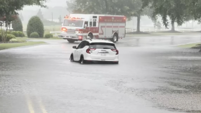 Roads flooded and vehicles were stranded on Sunday, July 6, 2025 in Moore County, North Carolina.