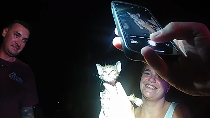 The sheriff's deputy takes a photo of Piper after she was freed.
