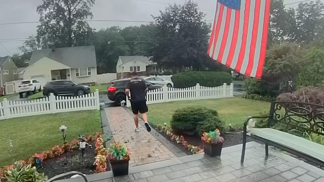 Delivery driver runs back to his car after nearly getting hit by lightning.