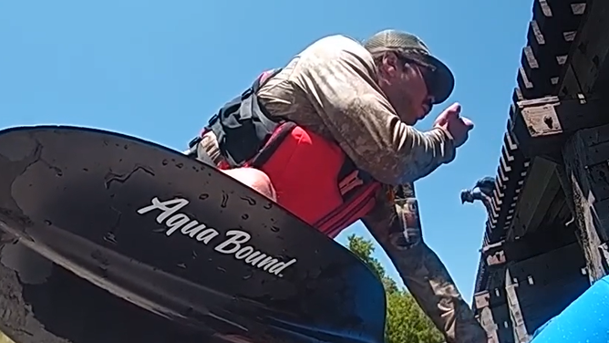 A bystander radios in for help using the ranger's microphone.