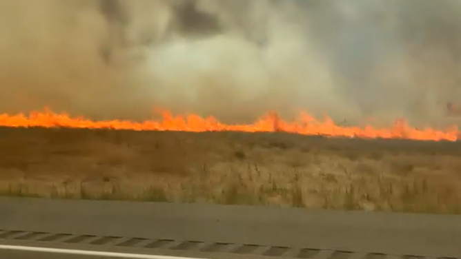 Flames burn right off the road.