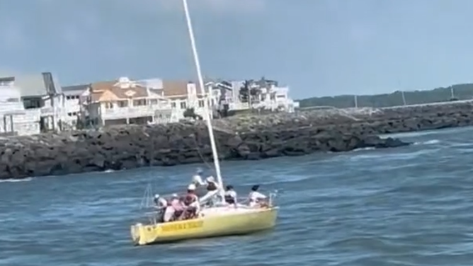The sailboat before it hit the jetty and sank.
