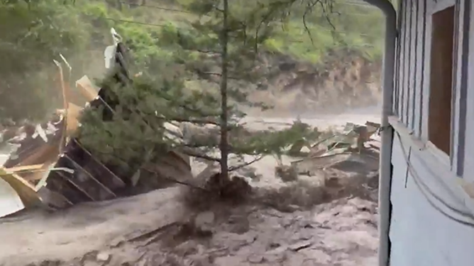 What's left of the home floats down river.