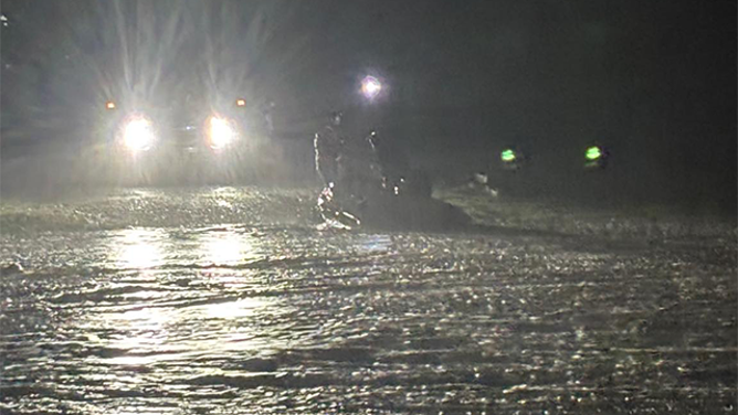 This photo shared by the Texas Game Wardens shows first responders boarding a boat during flash flooding on July 13, 2025.