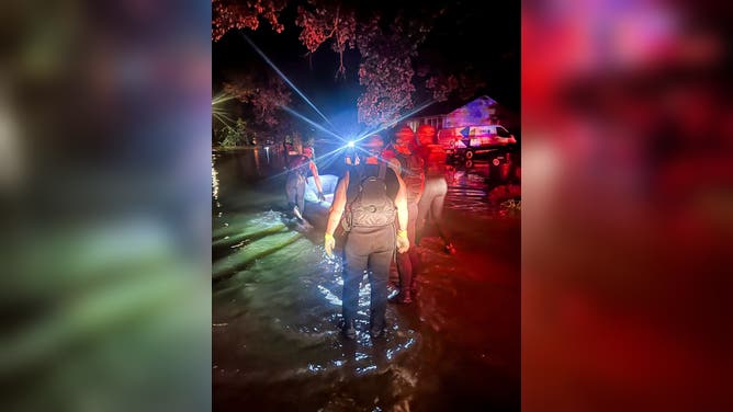CHATTANOOGA, TN — Swift water rescue teams perform water rescues late Tuesday evening after near-record flooding.