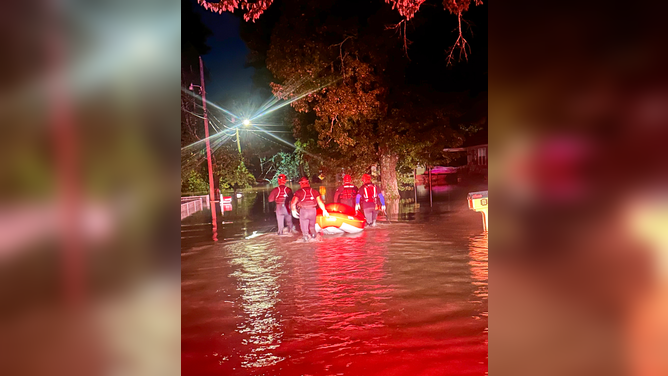 CHATTANOOGA, TN — Swift water rescue teams perform water rescues late Tuesday evening after near-record flooding.