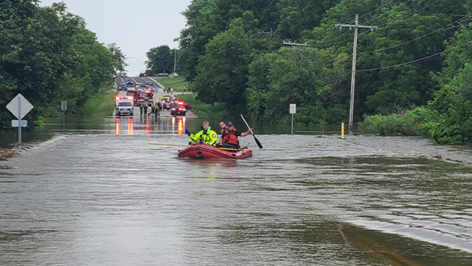 This photo provided by the Franklin Fire Department in Wisconsin shows a teenager being rescued from floodwaters on Aug. 10, 2025.