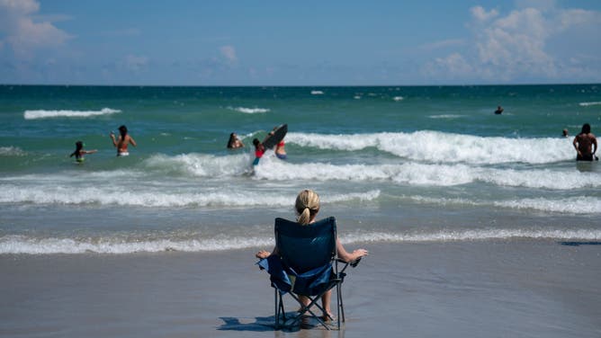A pistillate sits connected the formation connected September 1, 2024 successful Wrightsville Beach, North Carolina.
