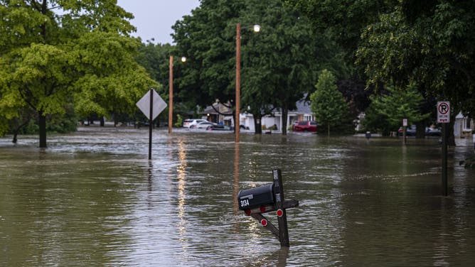 WAUWATOSA, WISCONSIN - AUGUST 10: Flooding along the Menomonee River on August 10, 2025 in Wauwatosa, Wisconsin. Heavy downpours brought as much as 13 inches of rain to parts of southeast Wisconsin overnight, resulting in widespread flooding across the region. (Photo by Andy Manis/Getty Images)