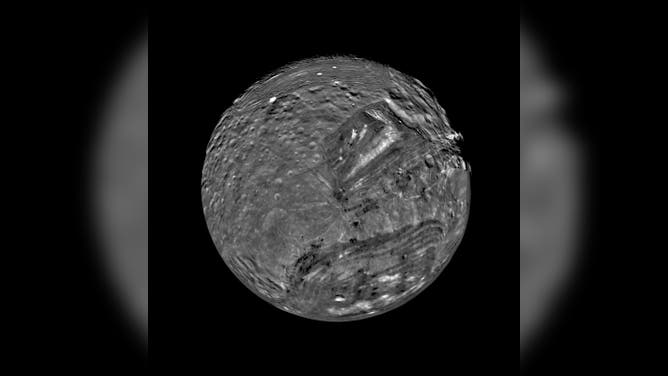 Photo of the moon Miranda around Uranus.