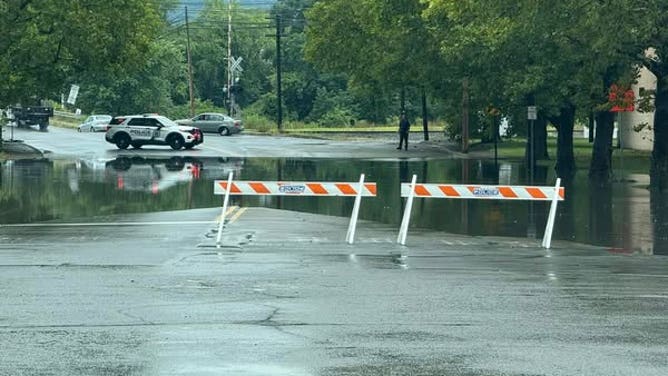 Scranton police block flooded intersections during severe thunderstorms Wednesday, August 14, 2025.