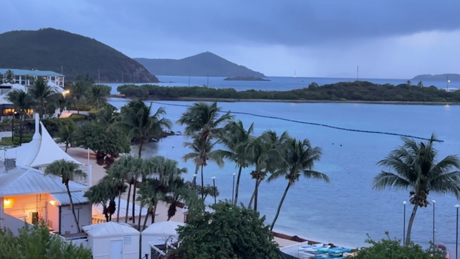 Rain lashes St. Thomas arsenic  Hurricane Erin moves northbound  of the U.S. Virgin Islands connected  Saturday.