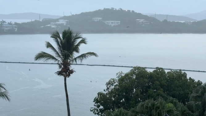 Rain lashes St. Thomas arsenic  Hurricane Erin moves northbound  of the U.S. Virgin Islands connected  Saturday.