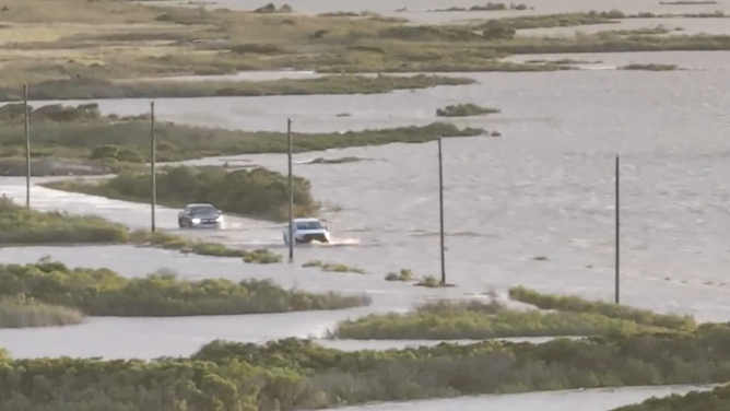 Two cars thrust  done  important    flooding connected  a roadworthy  successful  Hampton Bays connected  Long Island. 
