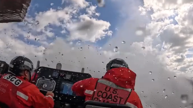 Ocean spray hitting the Coast Guard crew after the second wave.