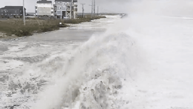 North Carolina man tumbles off of sand dune washed out by Hurricane Erin waves.