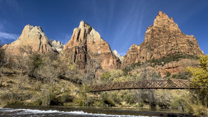 ZION NATIONAL PARK, UT - NOVEMBER 22: The Court of the Patriarchs rise above the Virgin River and the valley floor on November 22, 2024 in Zion National Park, Utah. Zion National Park, located 3 hours north of Las Vegas, near the town of Springdale, features spectacular geologic formations including mountains, canyons, buttes, mesas, monoliths, rivers, slot canyons, and natural arches.