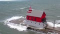 Waves batter Michigan lighthouse as powerful cold front sweeps through - Fox News