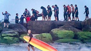 Watch: 2 swimmers saved from rip current along New York City beach