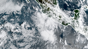 Mario fizzles along Mexico's Pacific coast, but still drenches shorelines with heavy rains