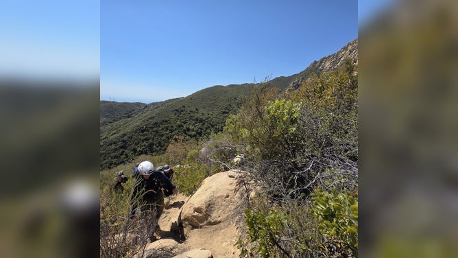 Santa Barbara Search and Rescue on Arlington Trail while looking helping dehydrated hikers.